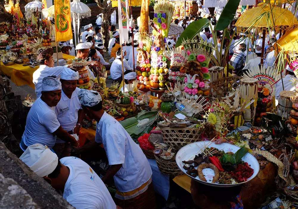 Banten tegeh - high offerings - are gathered in the central courtyard of a village temple during an odalan temple ceremony in Suwug Village, North Bali, Indonesia