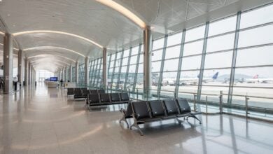 Hong Kong International Airport terminal interior with parked aircraft