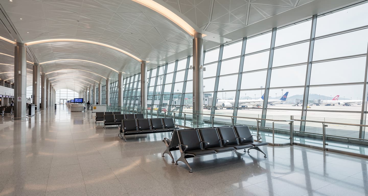 Hong Kong International Airport terminal interior with parked aircraft