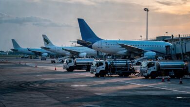 Jet planes and fuel trucks at a Southeast Asian airport