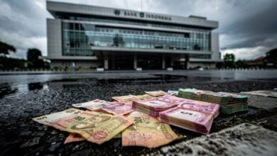 Bank Indonesia building with rupiah currency in foreground, Jakarta