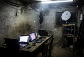 Clandestine internet café with Starlink terminal in Myanmar conflict zone