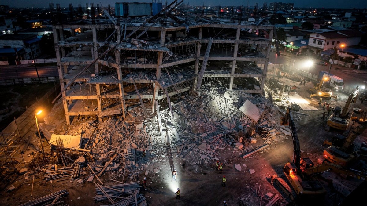 Collapsed building construction site in Angeles City, Philippines, at dusk