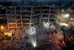 Collapsed building construction site in Angeles City, Philippines, at dusk