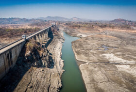 Drought-stressed hydroelectric dam with critically low water levels, Southeast Asia