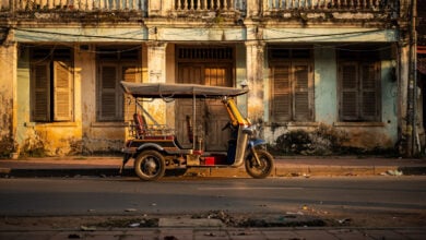 Empty tuk-tuk outside closed guesthouse, Siem Reap, Cambodia