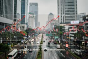 Financial charts with Jakarta financial district background