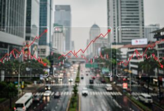 Financial charts with Jakarta financial district background