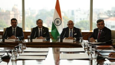 Formal diplomatic conference table, New Delhi, four-nation ministerial meeting, Indian flag