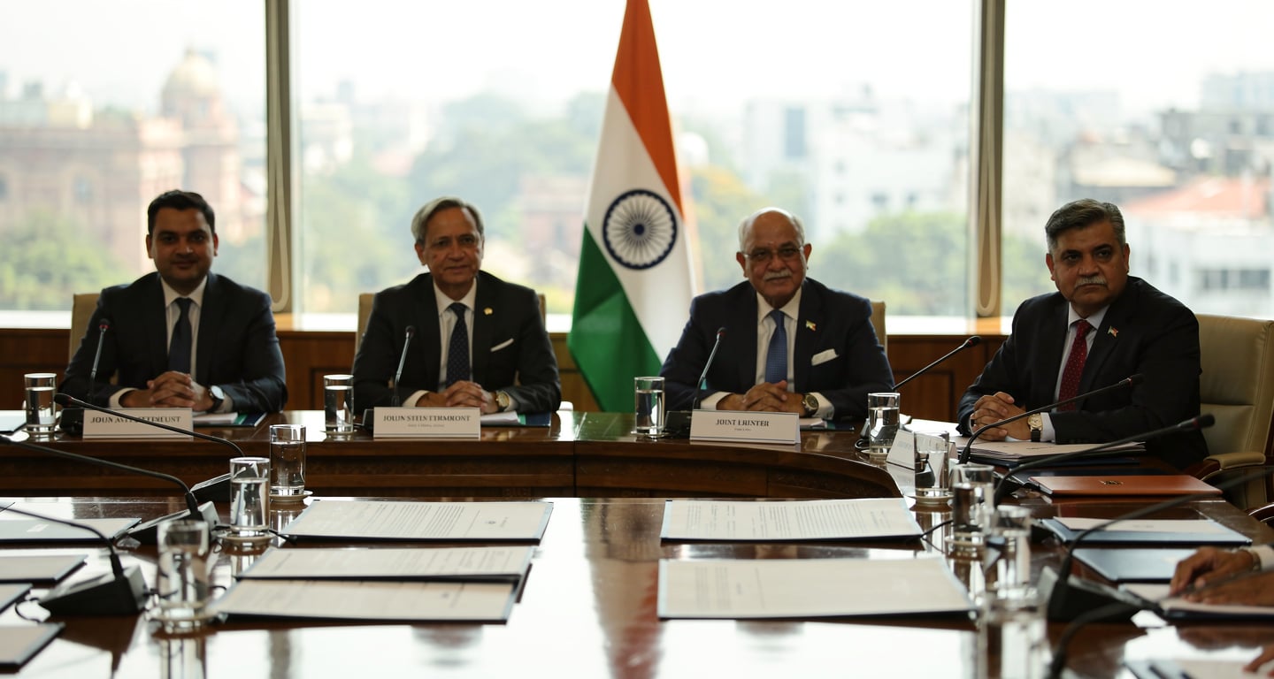 Formal diplomatic conference table, New Delhi, four-nation ministerial meeting, Indian flag
