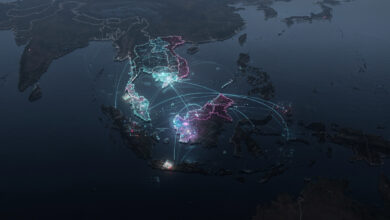 Fragmented digital networks and data streams over Southeast Asia map at night