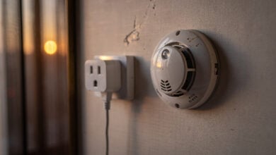 Hotel room power adaptor and smoke detector, Chinese interior, evening light