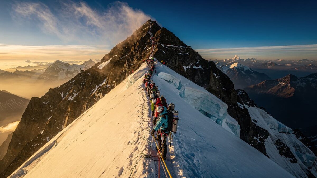 Long queue of climbers on fixed line near Everest summit, Nepal side
