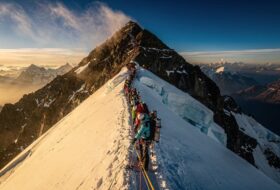 Long queue of climbers on fixed line near Everest summit, Nepal side