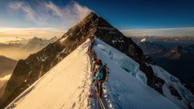 Long queue of climbers on fixed line near Everest summit, Nepal side