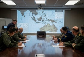Pentagon war room with military officers reviewing Taiwan Strait strategic maps