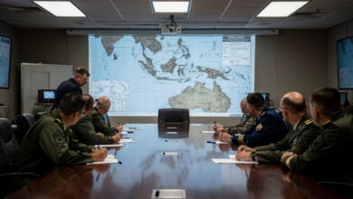 Pentagon war room with military officers reviewing Taiwan Strait strategic maps