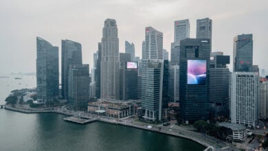 Singapore financial district skyline with modern office towers under overcast sky