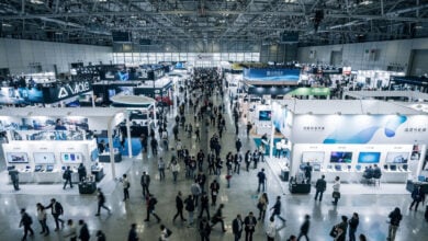 Tech convention floor with booths and attendees, Taipei Nangang Exhibition Center