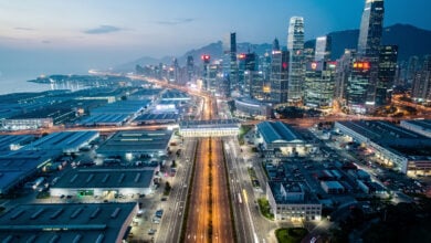 Aerial view of Shenzhen-Hong Kong border showing industrial and financial districts at dusk