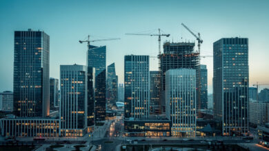 Astana financial district skyline at dusk, Kazakhstan, modern glass towers and construction