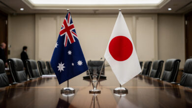 Australian and Japanese flags at diplomatic meeting table, Canberra