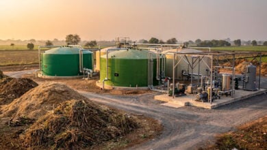 Biogas plant facility with digesters and compression equipment in rural Madhya Pradesh, India