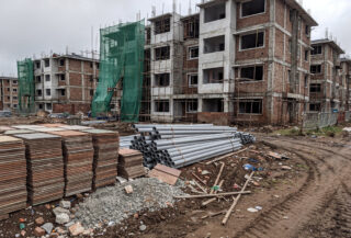 Construction materials and apartment building site in Kochi, Kerala