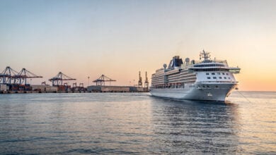 Cruise ship departing Mediterranean port at dawn, Eastern Mediterranean Sea