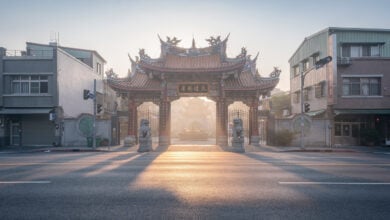 Empty Taipei temple entrance at dawn, minimal crowds, soft morning light