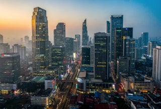 Jakarta financial district at dusk with modern banking towers and office buildings