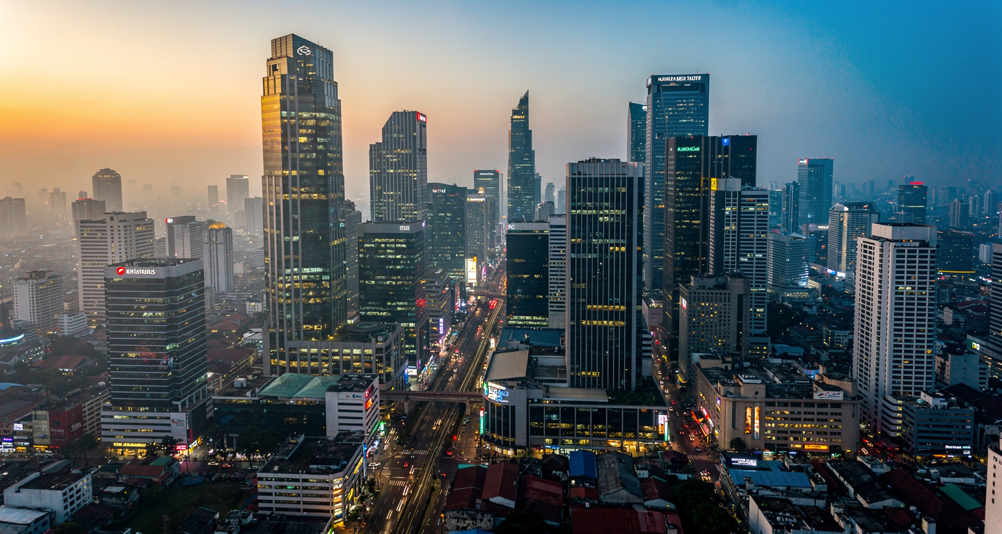 Jakarta financial district at dusk with modern banking towers and office buildings