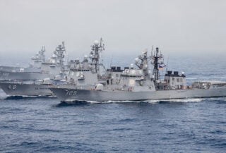 Japanese destroyer in formation with allied naval vessels, South China Sea