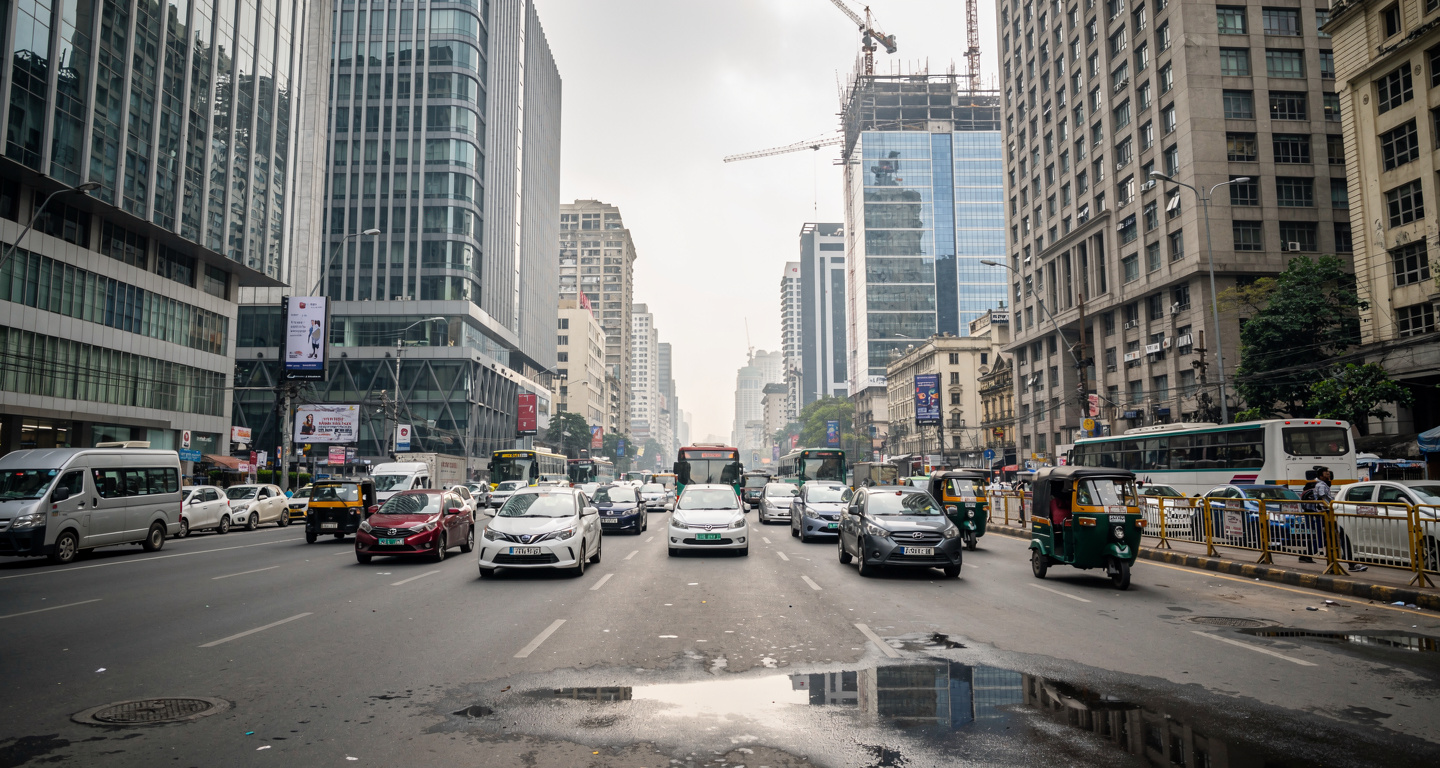 Mumbai financial district with modern office buildings and traffic under overcast light