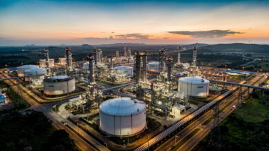 Petronas Chemicals refinery complex, Malaysia, industrial pipelines and storage tanks at dusk