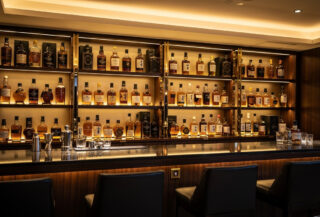 Premium whisky bottles displayed in Tokyo bar, American and Japanese spirits side by side
