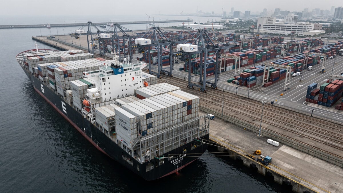 Refrigerated cargo containers stacked at Japanese port terminal