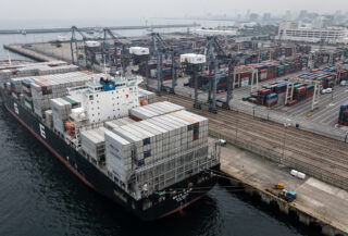 Refrigerated cargo containers stacked at Japanese port terminal