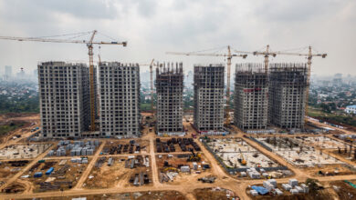 Residential construction site with cranes and apartment towers under development, Mumbai or Bangalore