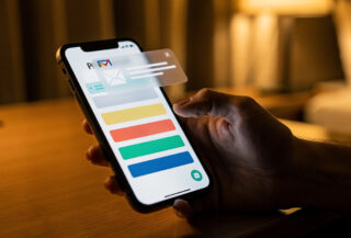 Smartphone showing hotel booking confirmation with email notification overlay