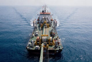 Subsea cable installation vessel deploying fibre-optic cables in South China Sea waters