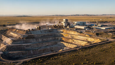 Uranium mining facility in Kazakhstan steppe with processing equipment and open pit