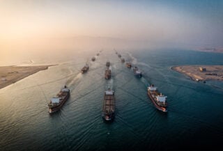 Aerial view of oil tankers transiting the Strait of Hormuz at dawn