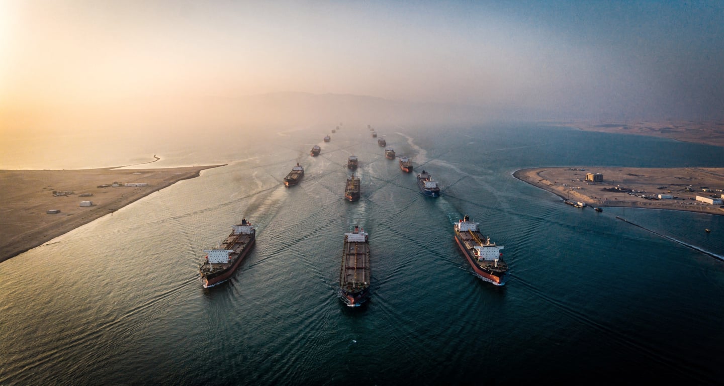 Aerial view of oil tankers transiting the Strait of Hormuz at dawn