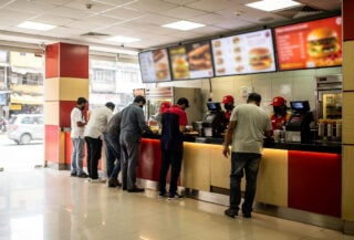 Burger King restaurant interior in Mumbai, India during daytime service