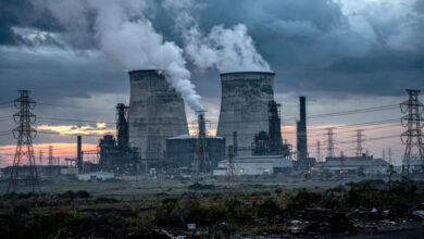 Coal power plant with cooling towers in Johor, Malaysia, industrial landscape at dusk