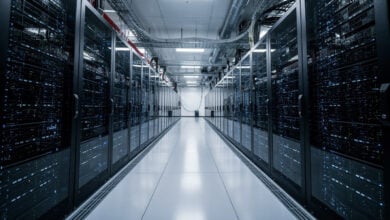 Data center interior with GPU server racks under blue LED lighting, Tokyo