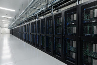 Data center interior with GPU server racks and industrial cooling infrastructure, Japan