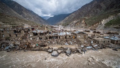 Destroyed buildings and debris in flooded mountain valley, Nuristan province, Afghanistan