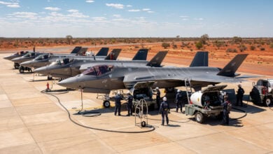 F-35A fighters on tarmac at RAAF Base Tindal with multinational ground crews performing joint maintenance